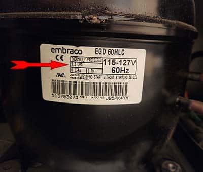 Manufacturers lable showing 9.3 LRA (locked rotor amps) for the compressor to start.