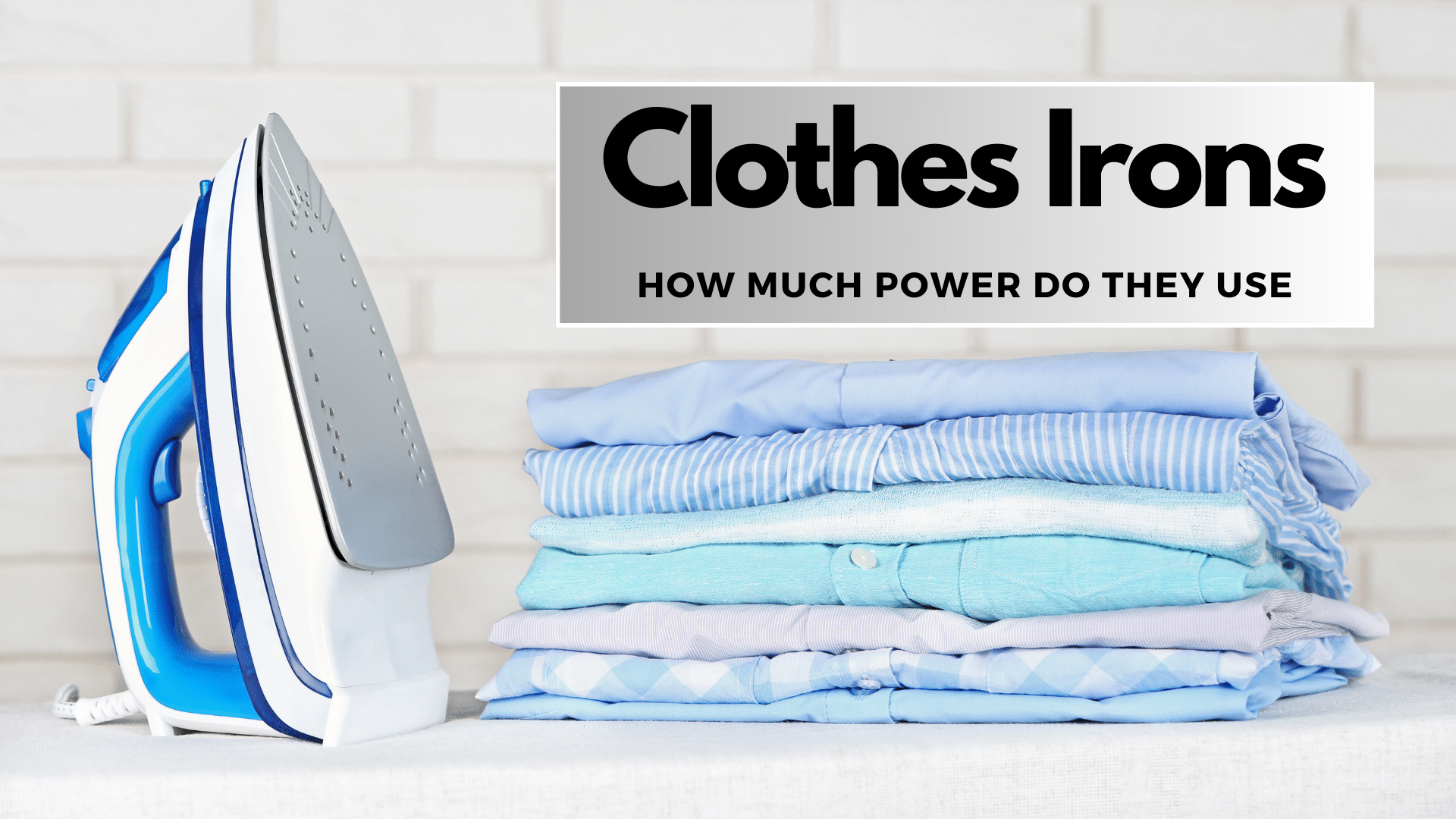 Image of clothes iron next to a stack of folded clothes.